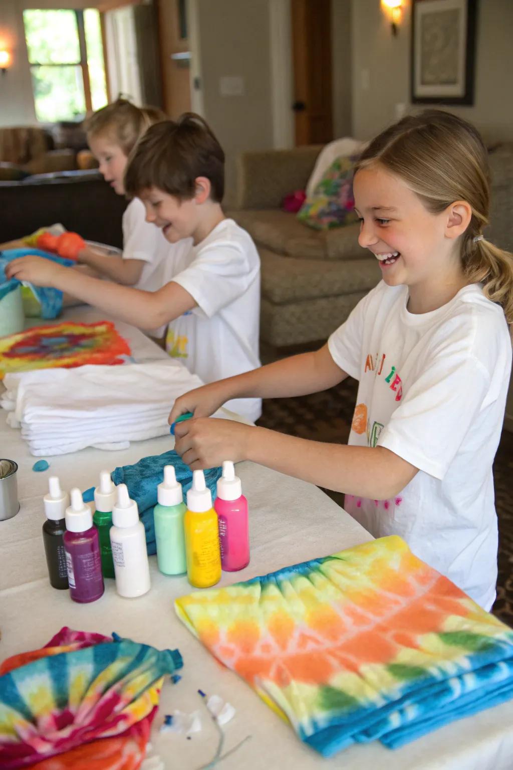 Kids enjoying a tie-dye t-shirt activity.