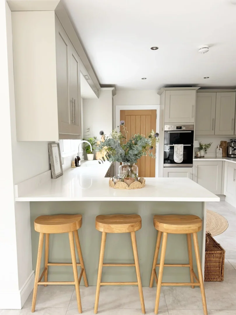 12. Crisp White Kitchen with Natural Wood Stools (Small White Kitchen Ideas)