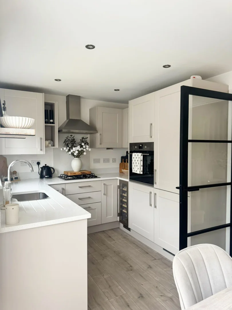 3. Modern White with Industrial Touches (Small White Kitchen Ideas)