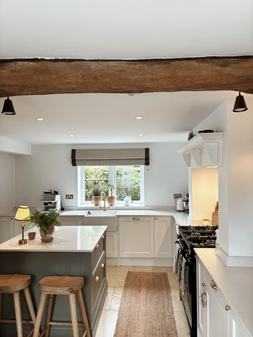 6. Cottage-Inspired Simplicity with Warm Details (Small White Kitchen Ideas)