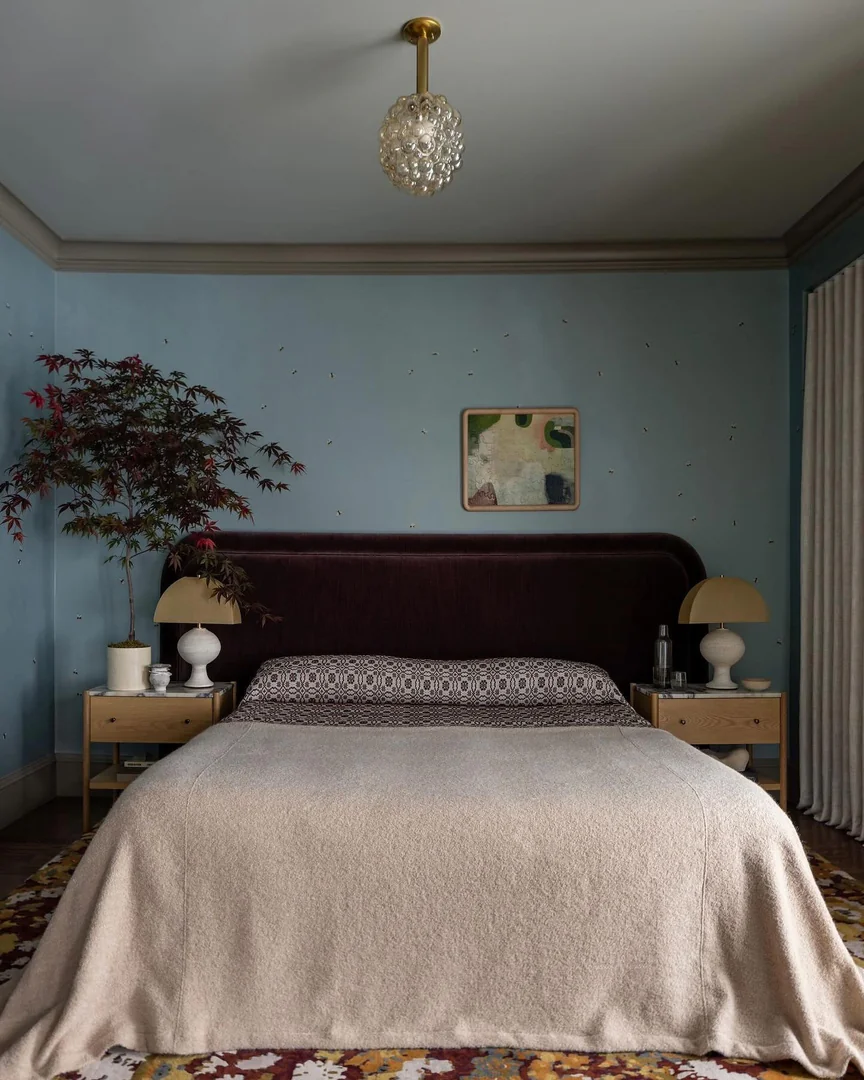 6. Soft Blue Walls with Earthy Accents (Blue Wall Bedroom Ideas)