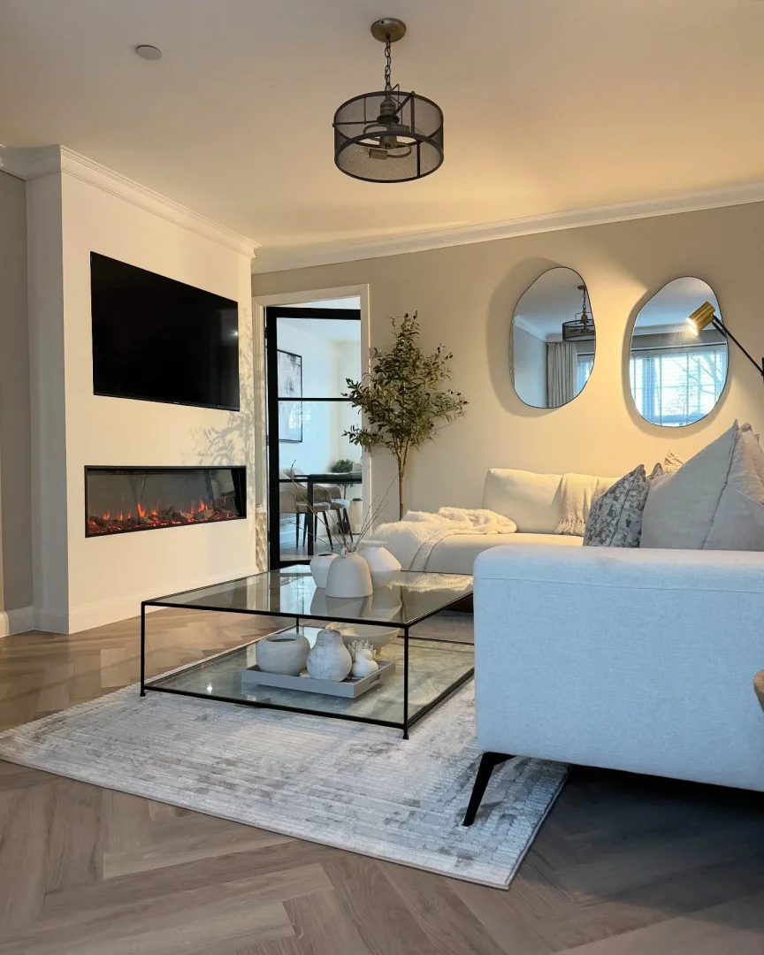 10. Modern Glass Sophistication (Neutral Living Room Ideas)