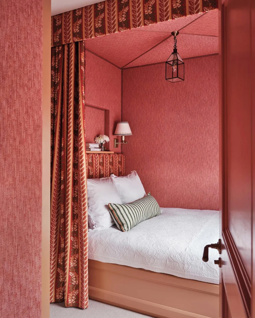 11. Cocooned Elegance in Deep Coral Drapery (Coral Bedroom Ideas)