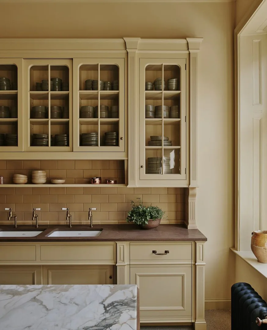 12. Creamy Ochre and Brownstone with Refined Cabinetry (Yellow Kitchen Ideas)