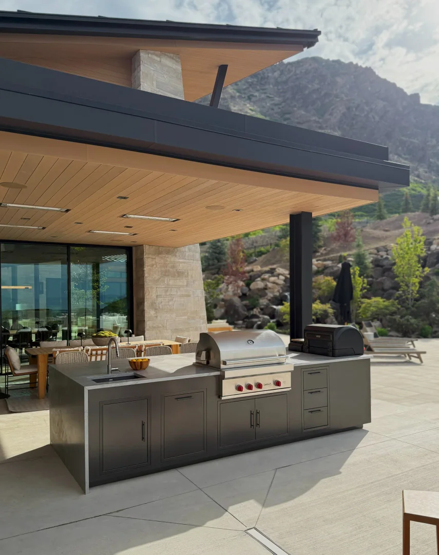 12. Minimalist Stone and Steel Outdoor Kitchen (Rustic Outdoor Kitchen Ideas)