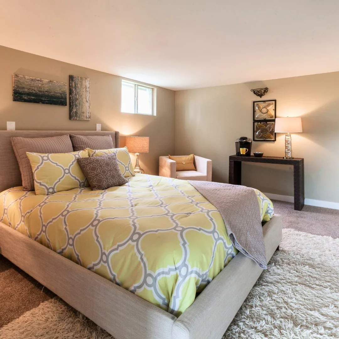 14. Soft Gold Pop in a Neutral Shell (Basement Bedroom Ideas)
