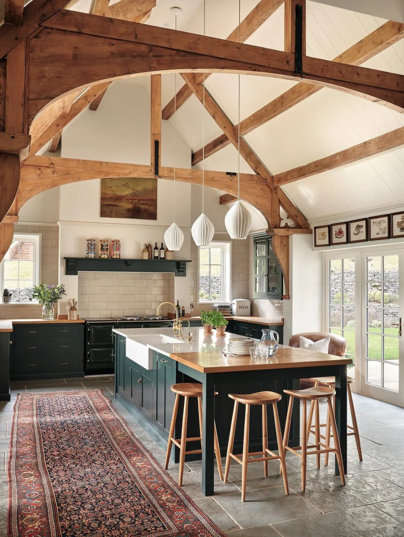 2. Rustic Charm with Vaulted Beams and Dark Cabinetry (Barndo Kitchen Ideas)
