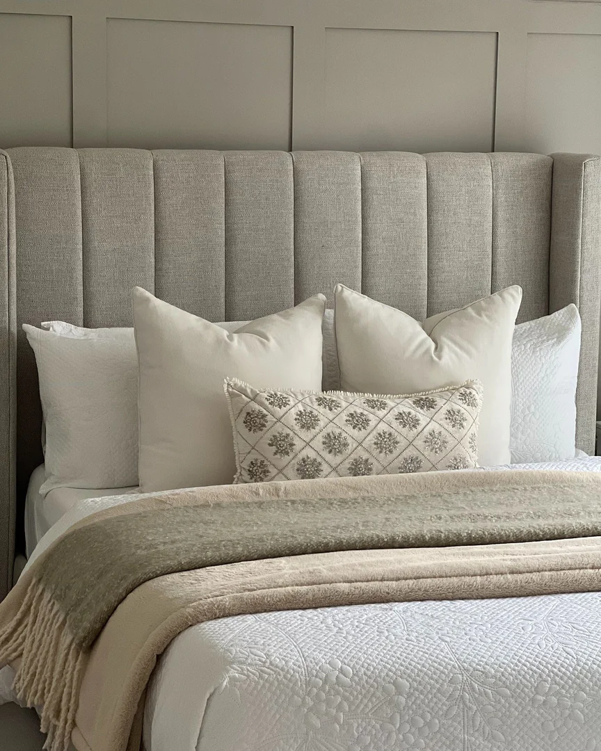 2. Warm Neutral Layers with Classic Paneling (Gray Wall Bedroom Ideas)