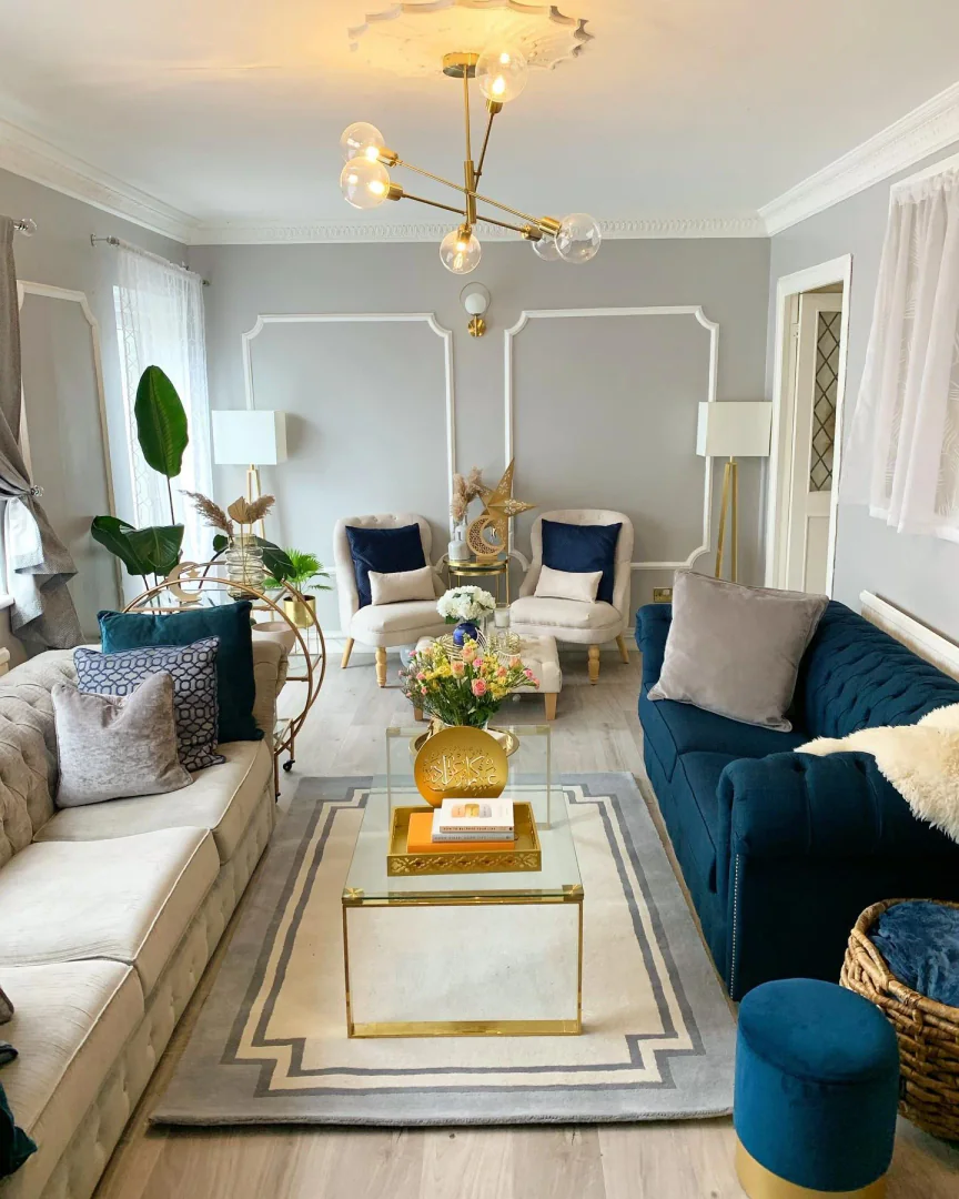 3. Contemporary Elegance with Navy and Gold Accents (Gold Living Room Ideas)