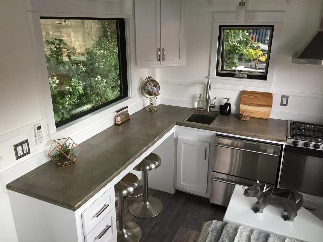 3. Sleek White and Concrete Kitchen with Industrial Edge (Tiny House Kitchen Ideas)