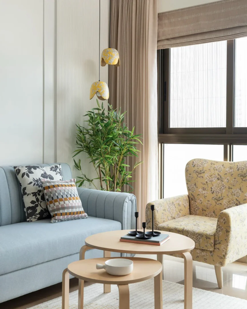 4. Soft Florals with Scandinavian Simplicity (Yellow and Blue Living Room Ideas)