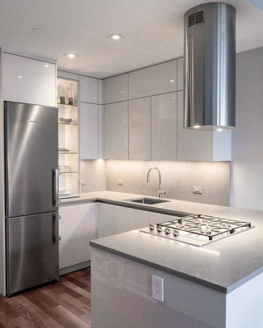 6. Matte Simplicity with Elevated Lighting (Light Gray Kitchen Ideas)