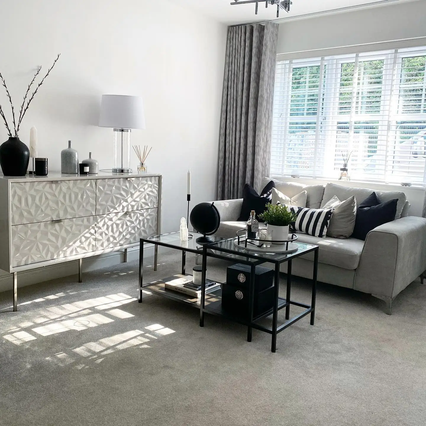 6. Refined Monochrome with Gloss Accents (Grey, Black and White Living Room Ideas)