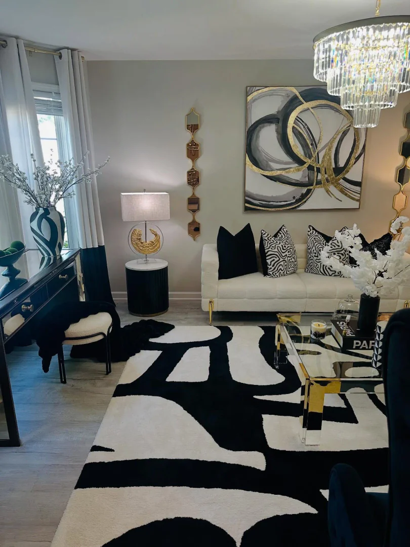 8. Bold Monochrome with Glam Touches (Large Living Room Wall Ideas)