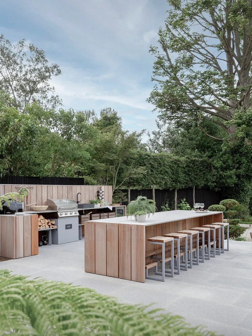 9. Modern Timber Dining + Grill Zone (Rustic Outdoor Kitchen Ideas)